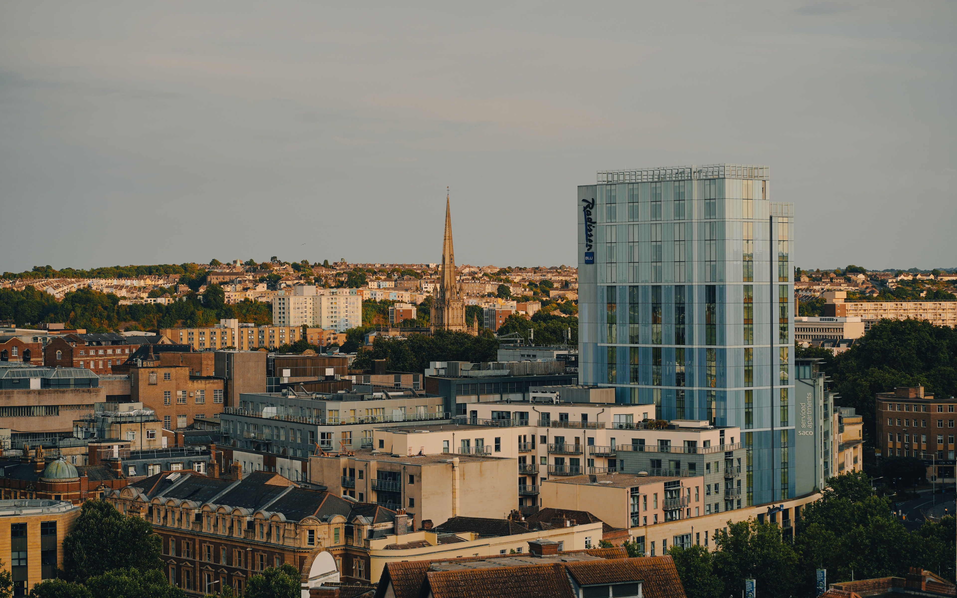 A panoramic view of Bristol's skyline featuring modern architecture and historic buildings.