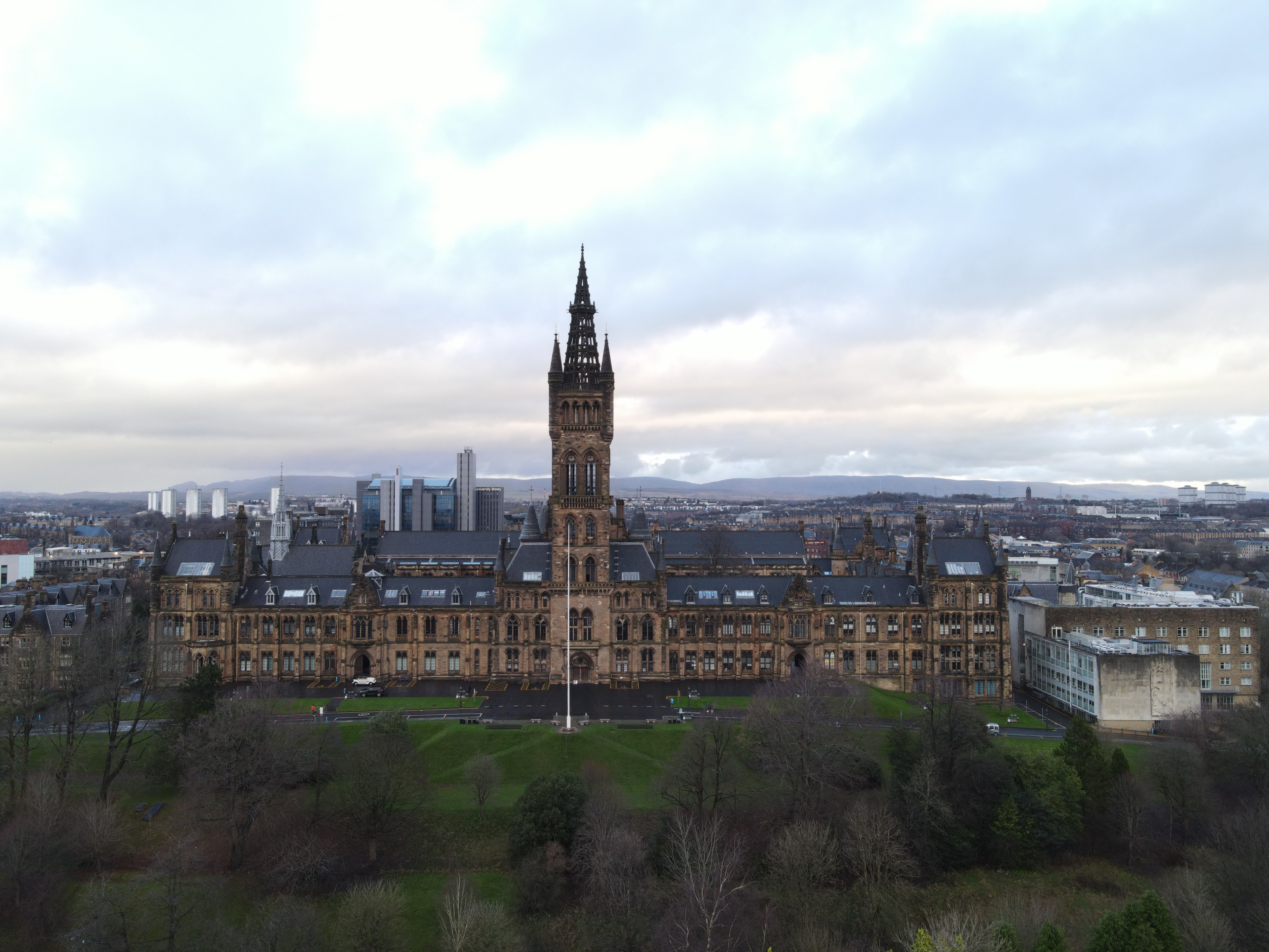 Stunning aerial view of the University of Glasgow with surrounding architecture and skyline.