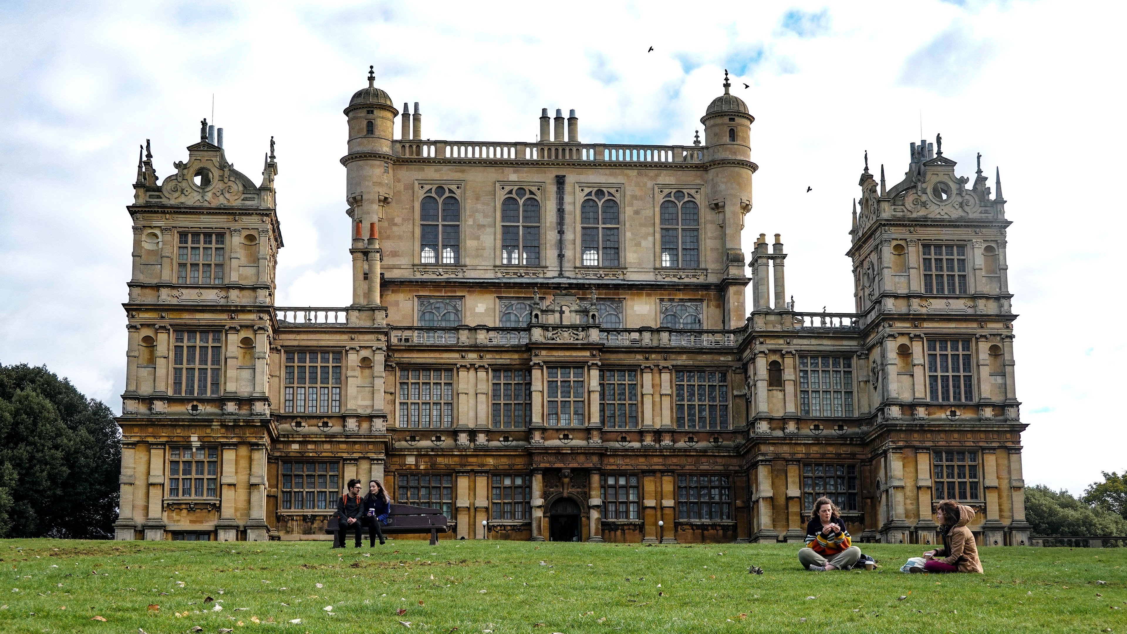 Wollaton Hall, a famous Elizabethan mansion in Nottingham, with people enjoying the park